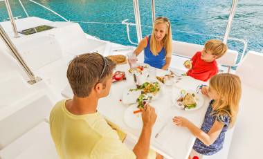 Family eating lunch on yacht