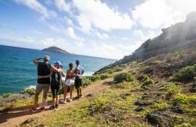 Couples hiking while on a charter vacation in St. Martin / St. Maarten