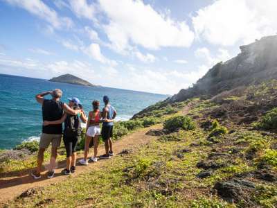 Couples hiking while on a charter vacation in St. Martin / St. Maarten